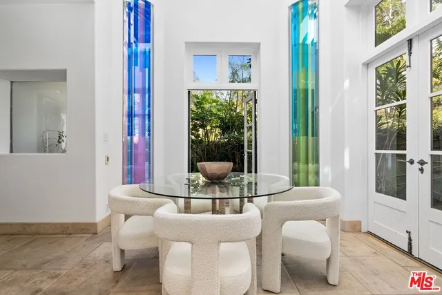 a kitchen with stainless steel appliances granite countertop sink stove and refrigerator