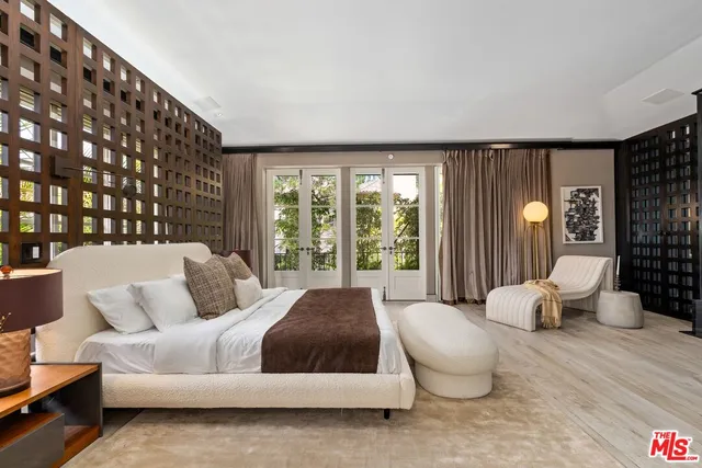 a lobby with furniture and view of bathroom