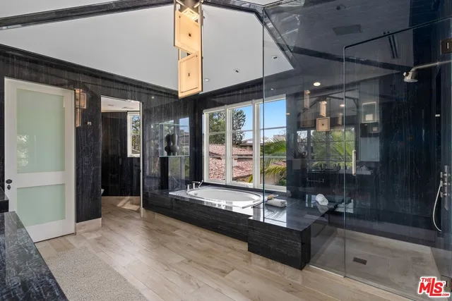 a living room with large window and a table