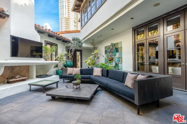 a living room with fireplace furniture and a flat screen tv