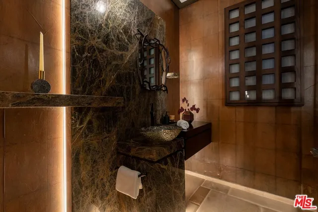 a view of a hallway with wooden floor and stairs