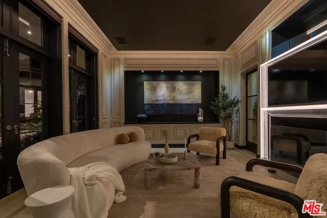 a living room with large windows