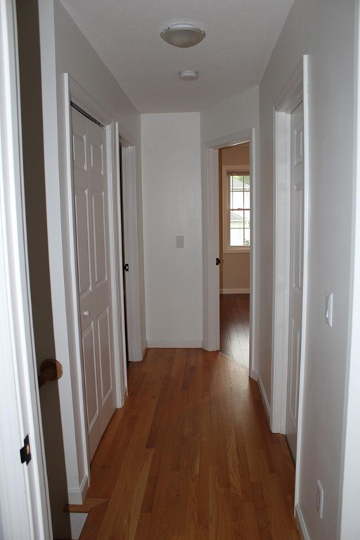 375 Springdale Road Westfield, MA 01085 - Photo 14 of 26 a view of a hallway with wooden floor