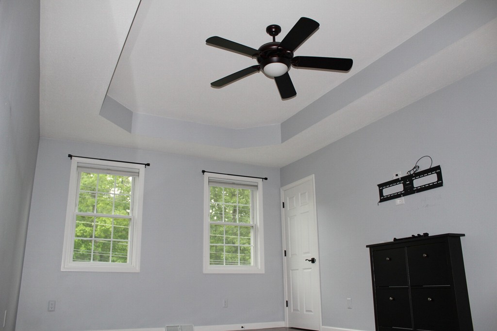 375 Springdale Road Westfield, MA 01085 - Photo 15 of 26 a a bedroom with a ceiling fan and a window