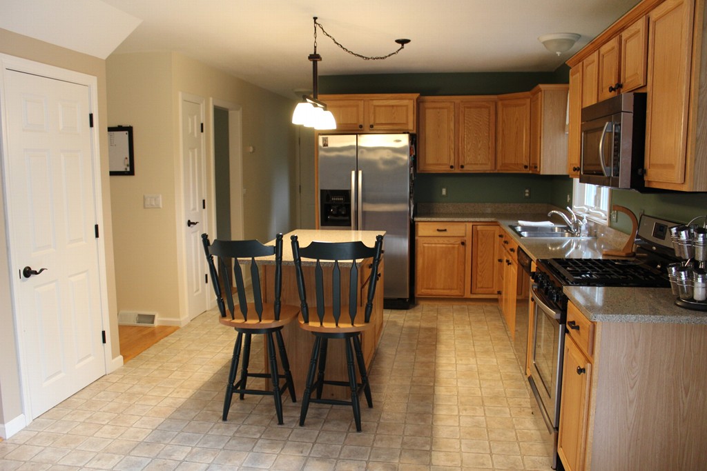 375 Springdale Road Westfield, MA 01085 - Photo 3 of 26 a kitchen with stainless steel appliances granite countertop sink stove top oven and cabinets