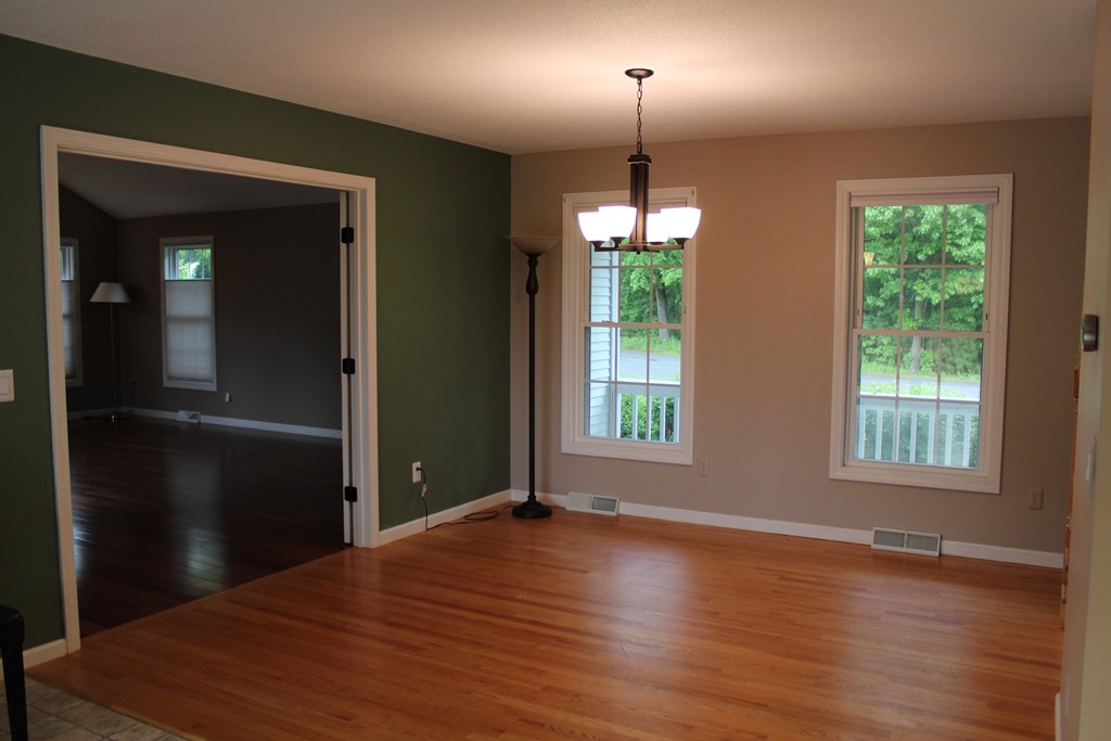 375 Springdale Road Westfield, MA 01085 - Photo 6 of 26 an empty room with wooden floor chandelier and windows
