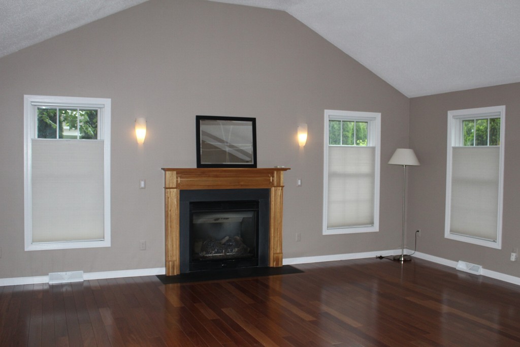 375 Springdale Road Westfield, MA 01085 - Photo 7 of 26 a view of an empty room with wooden floor and a window