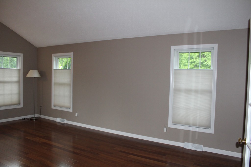 375 Springdale Road Westfield, MA 01085 - Photo 8 of 26 a view of an empty room with wooden floor and a window