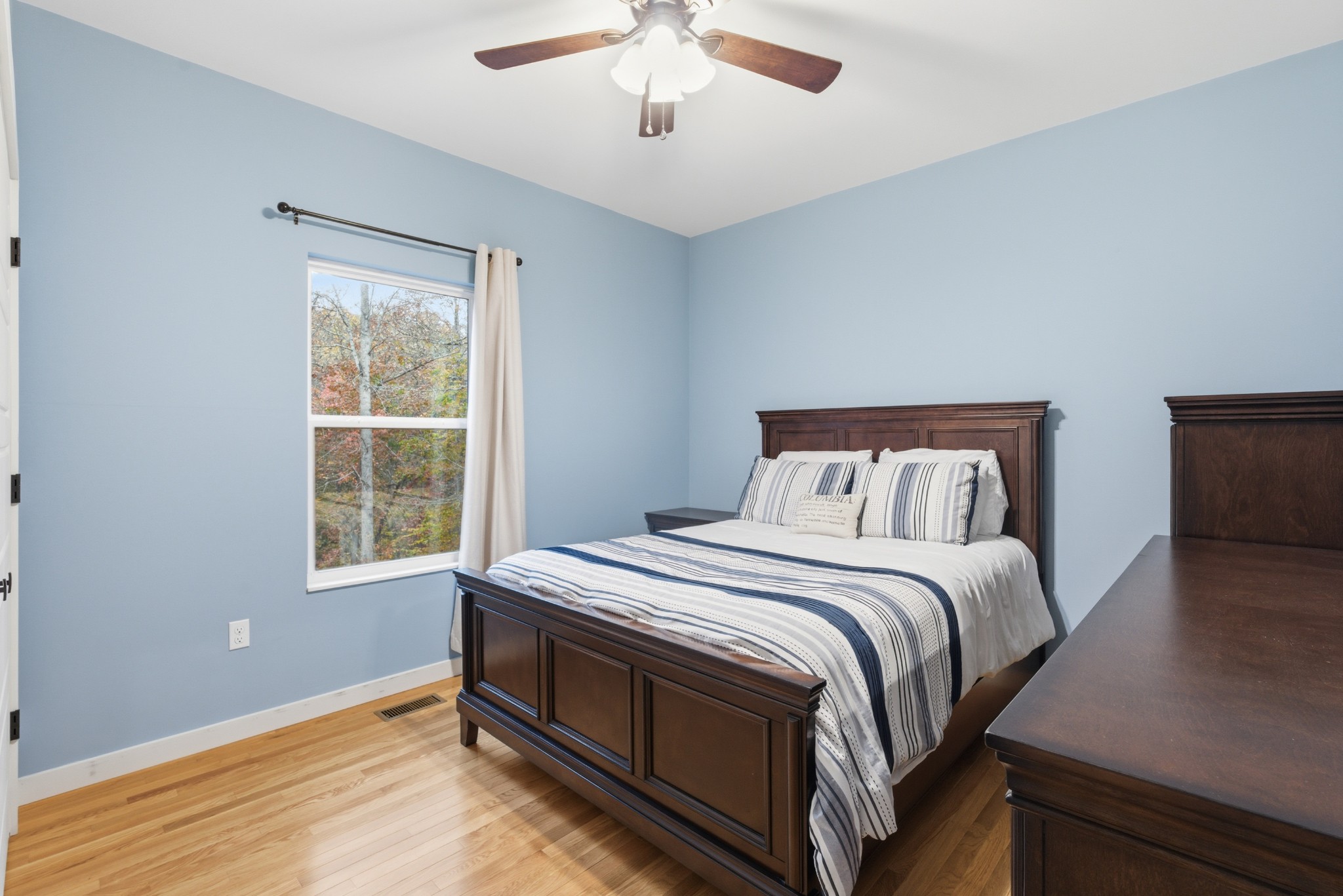 4310 Surji Circle Centerville, TN 37033 - Photo 18 of 27 a bed sitting in a bedroom next to a window