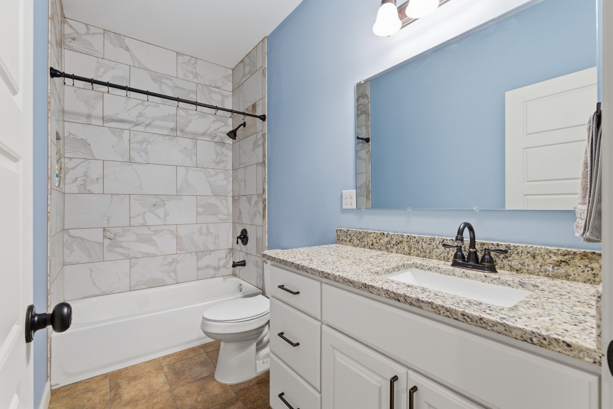 4310 Surji Circle Centerville, TN 37033 - Photo 20 of 27 a bathroom with a granite countertop sink a toilet and shower