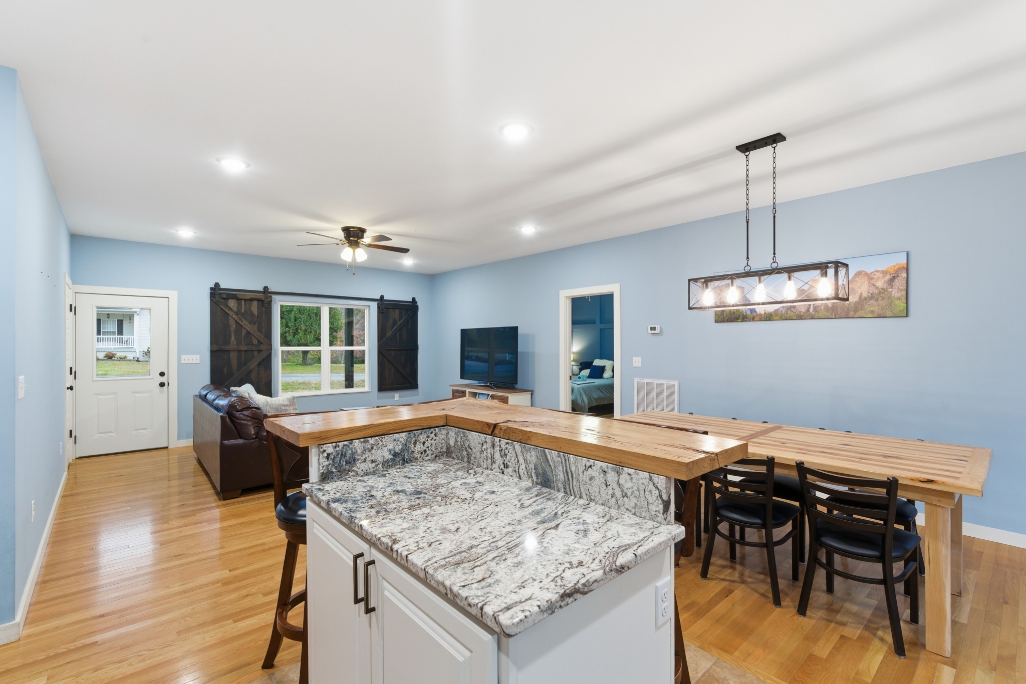 4310 Surji Circle Centerville, TN 37033 - Photo 23 of 27 a view of a dining room kitchen counter space and wooden floor