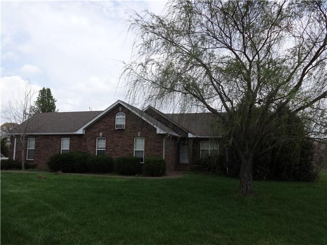 4921 Williams Road Cross Plains, TN 37049 - Photo 1 of 16 Front of Brick house on 14..64 acres with pond, barn and car shed that holds 12 + cars .