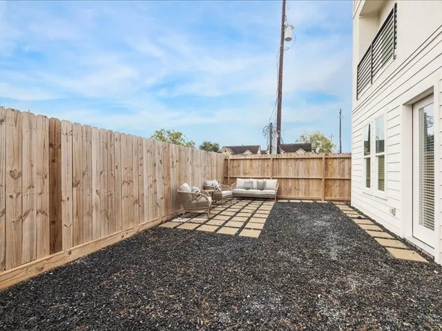a view of balcony with wooden floor