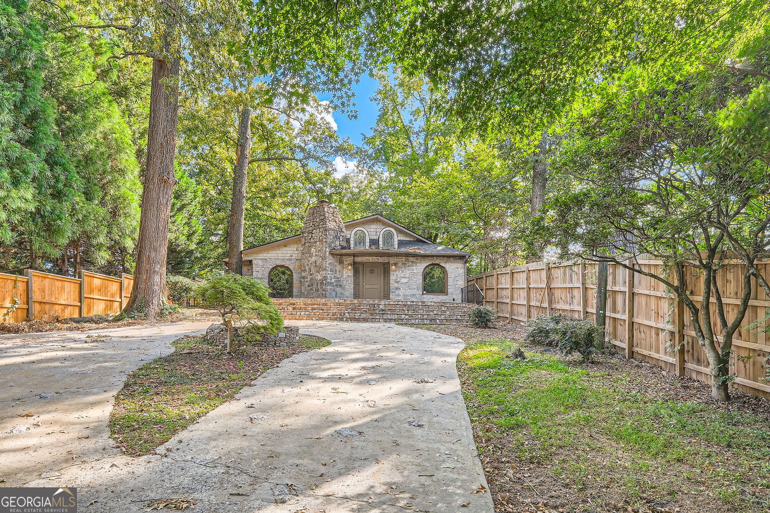 724 Collier Road Northwest Atlanta, GA 30318 - Photo 1 of 1 a view of a house with a yard and large tree