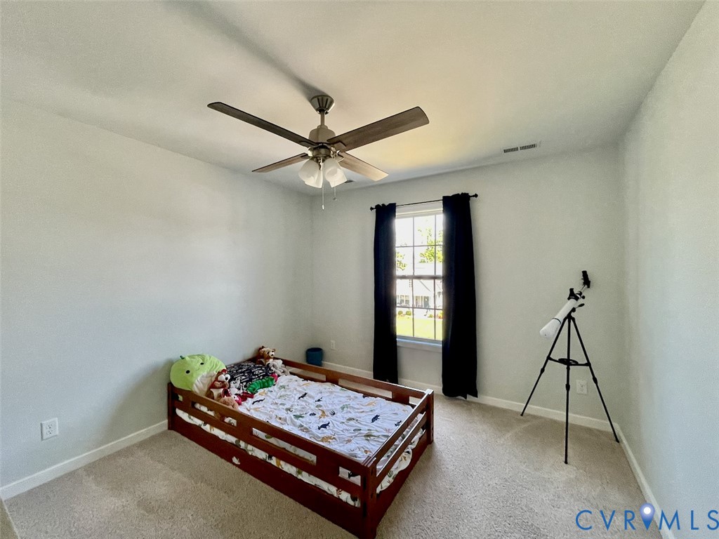 9506 Simonsville Road Midlothian, VA 23112 - Photo 21 of 27 a living room with hard wood floor and a window