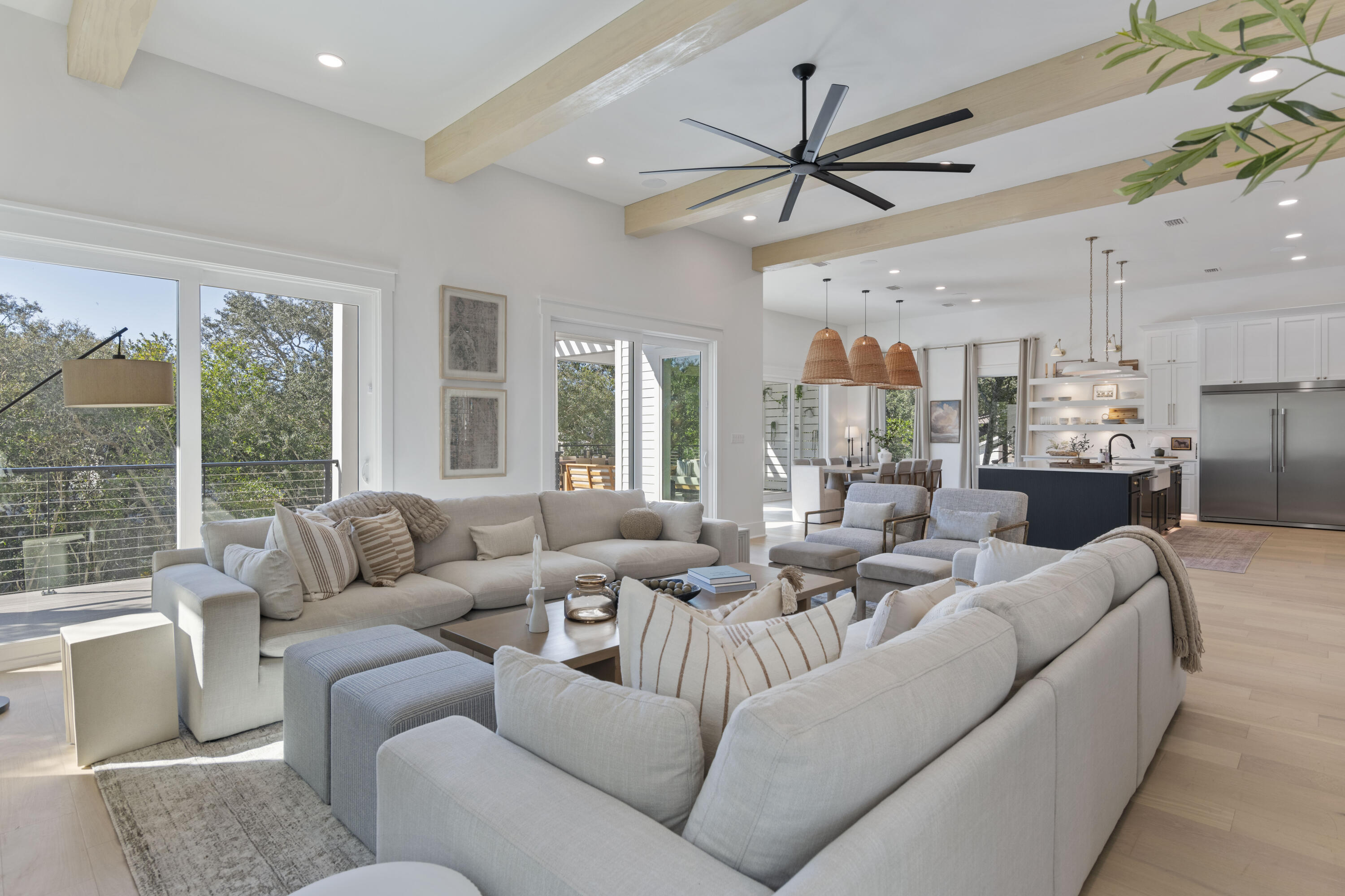 185 Dune Drive Santa Rosa Beach, FL 32459 - Photo 11 of 53 a living room with furniture ceiling fan and a large window