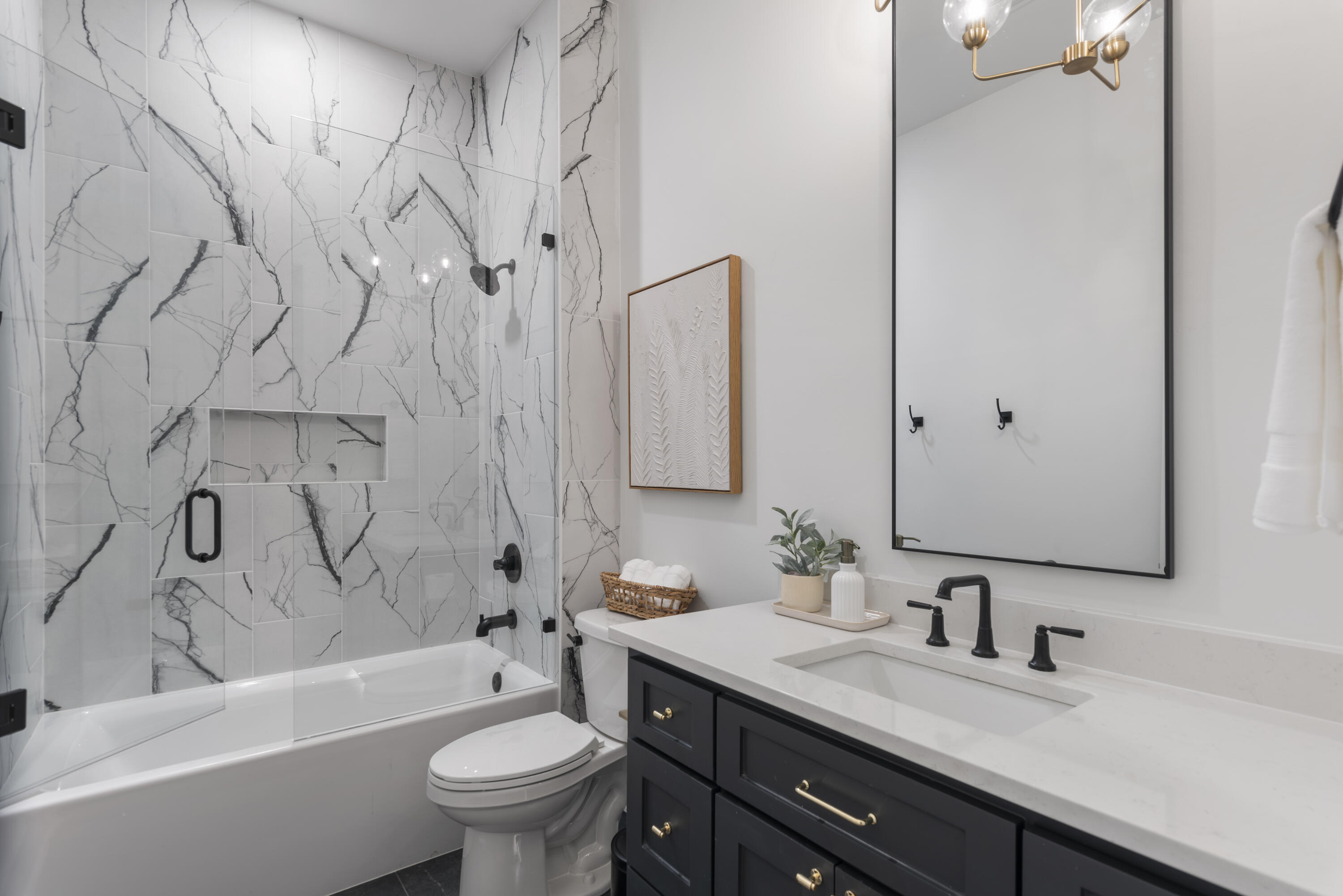 185 Dune Drive Santa Rosa Beach, FL 32459 - Photo 26 of 53 a bathroom with a granite countertop sink a toilet and a bathtub