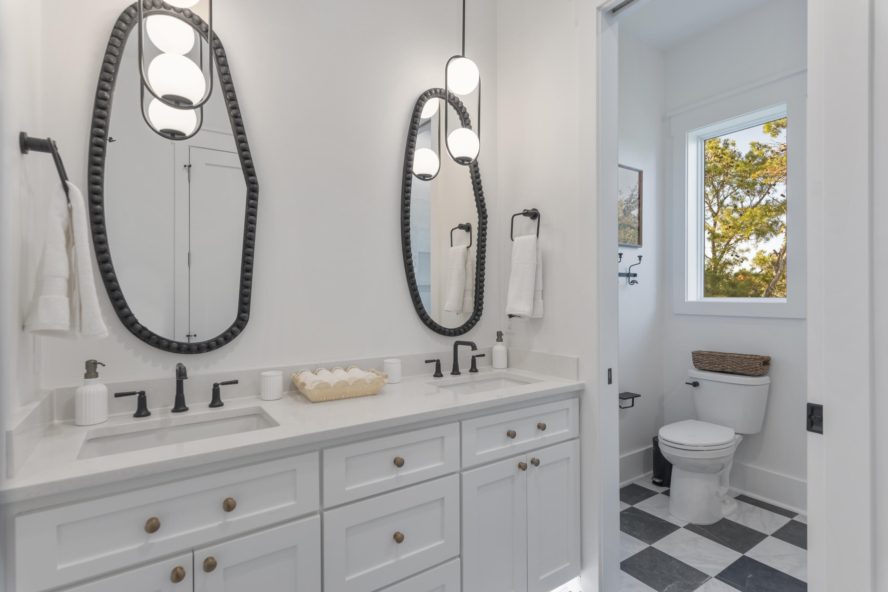 185 Dune Drive Santa Rosa Beach, FL 32459 - Photo 38 of 53 a bathroom with 2 sink and a mirror