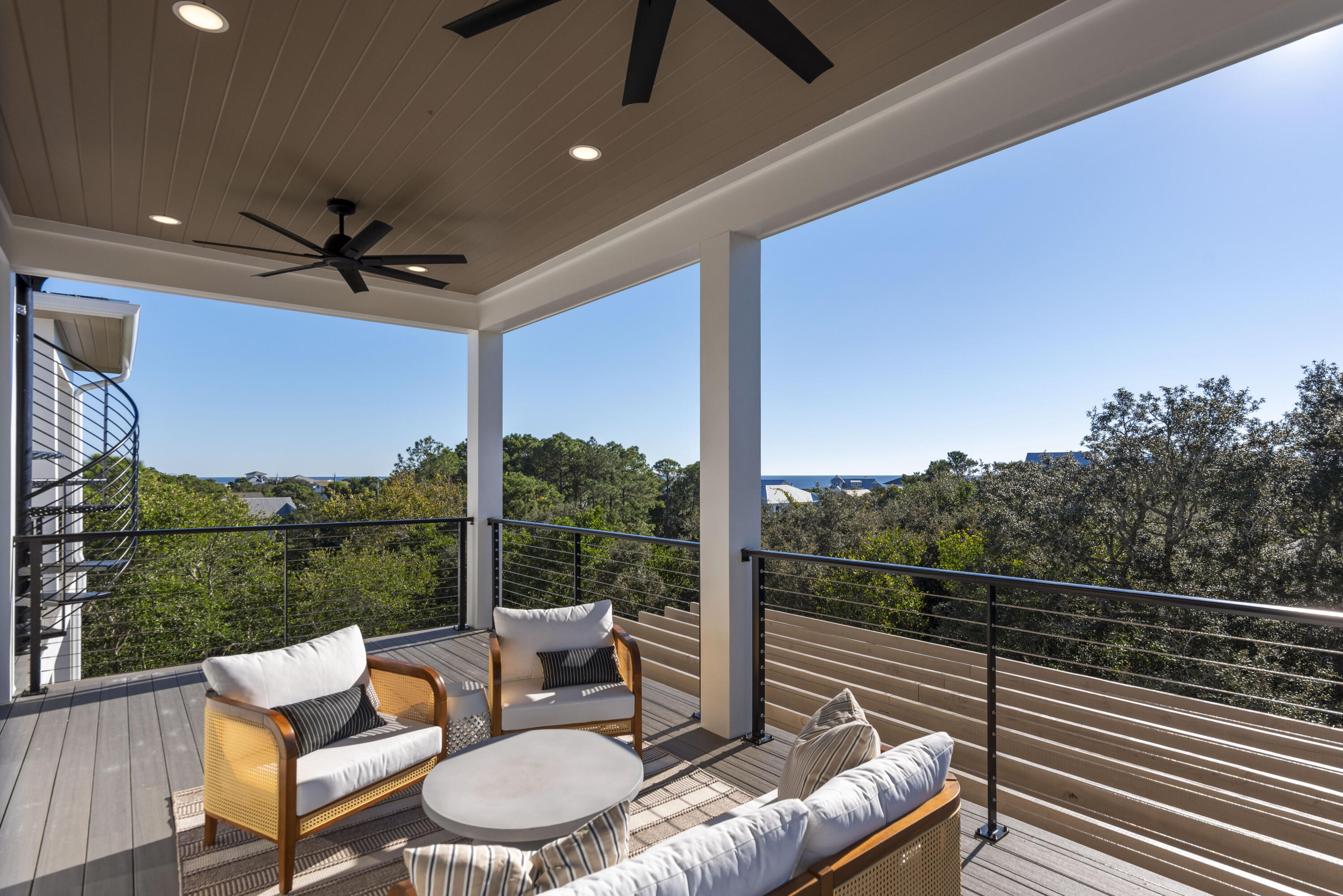 185 Dune Drive Santa Rosa Beach, FL 32459 - Photo 40 of 53 a view of a roof deck with couches and sky view