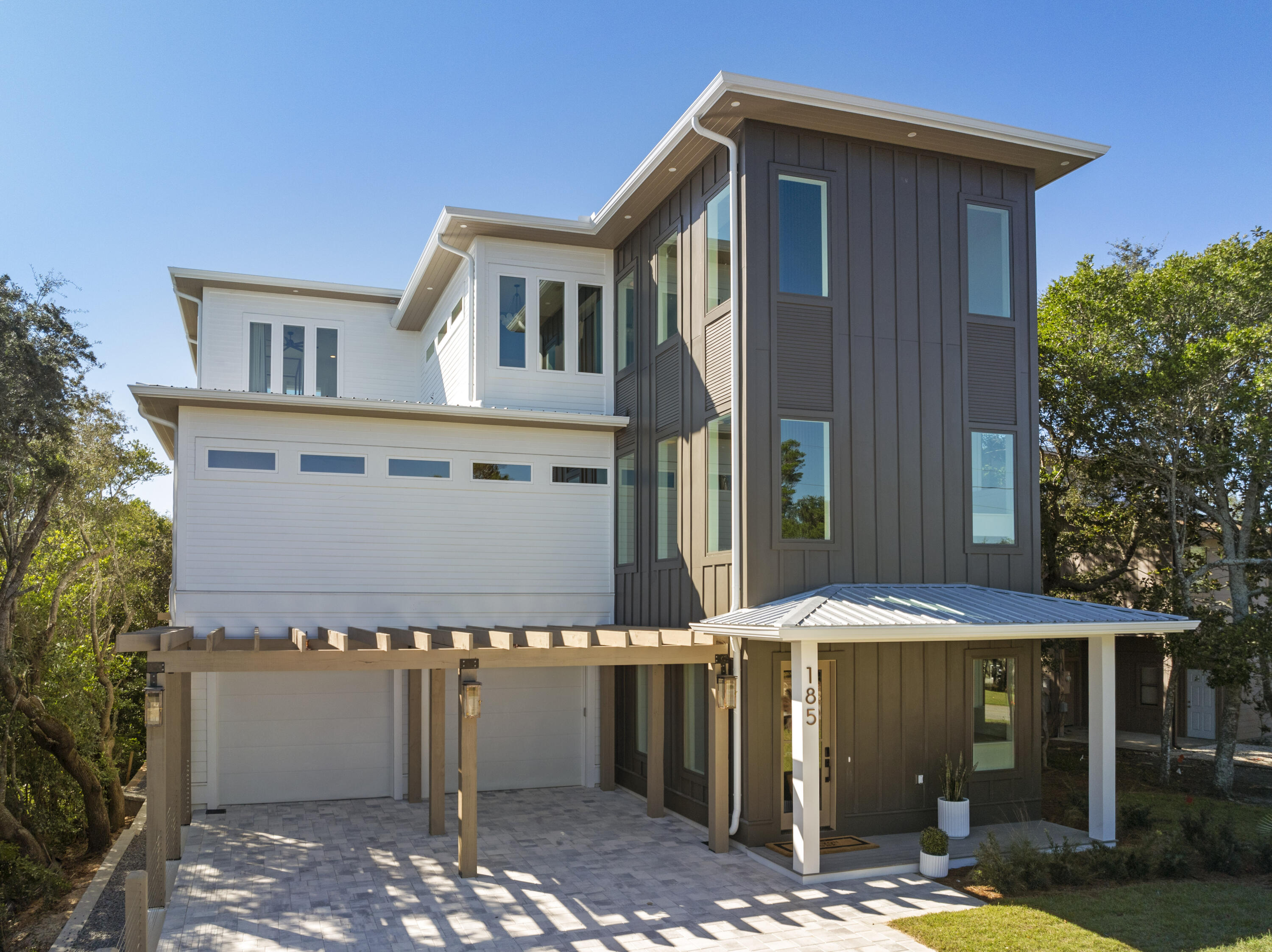 185 Dune Drive Santa Rosa Beach, FL 32459 - Photo 4 of 53 a front view of a house with garden