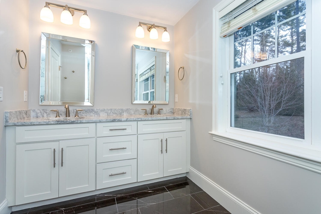 25 Brookview Road, Unit 25 Franklin, MA 02038 - Photo 13 of 28 a bathroom with a granite countertop sink mirror and double