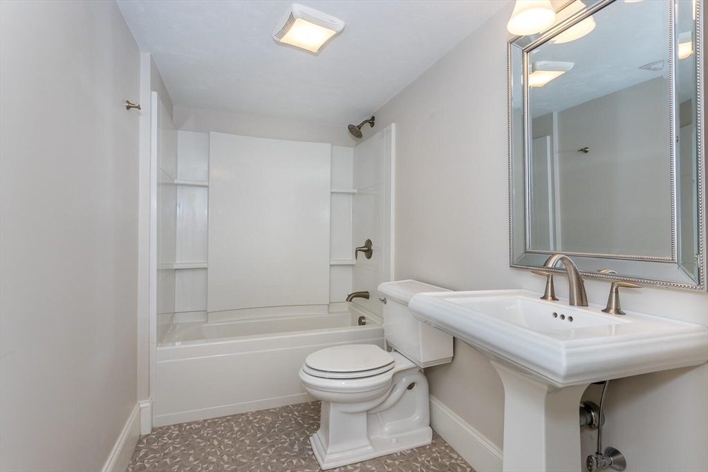 25 Brookview Road, Unit 25 Franklin, MA 02038 - Photo 24 of 28 a bathroom with a sink a toilet and shower