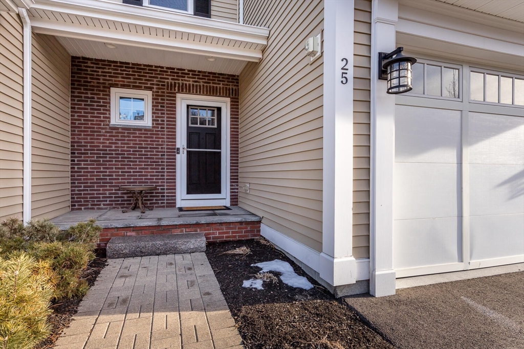 25 Brookview Road, Unit 25 Franklin, MA 02038 - Photo 3 of 28 a view of a house with a door and wooden floor