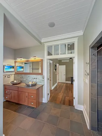 a kitchen with granite countertop a sink and cabinets
