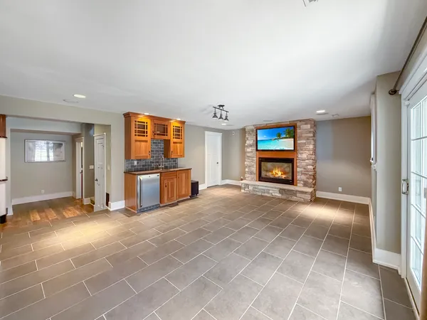 a view of a livingroom with furniture and a flat screen tv