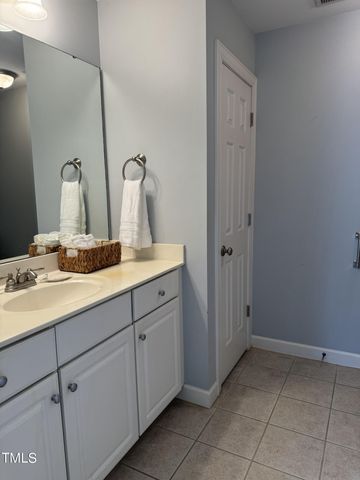 a bathroom with a sink and vanity
