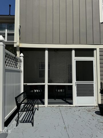 a view of a chairs and table in a backyard