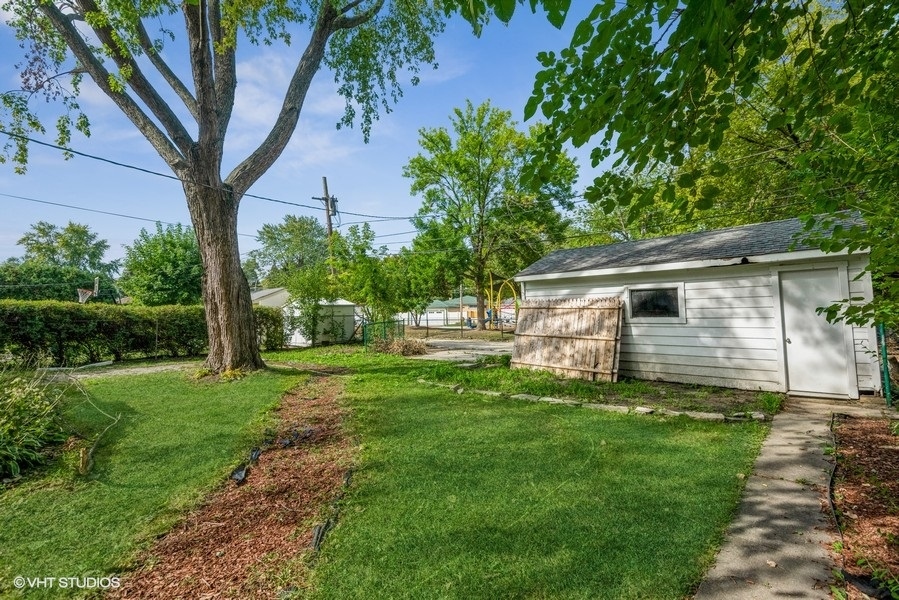 8640 East Prairie Road Skokie, IL 60076 - Photo 38 of 39 a view of a house with a yard