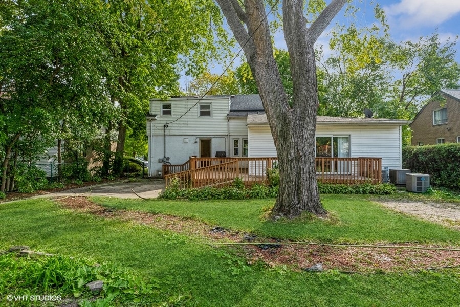 8640 East Prairie Road Skokie, IL 60076 - Photo 39 of 39 a view of a backyard with a garden and trees