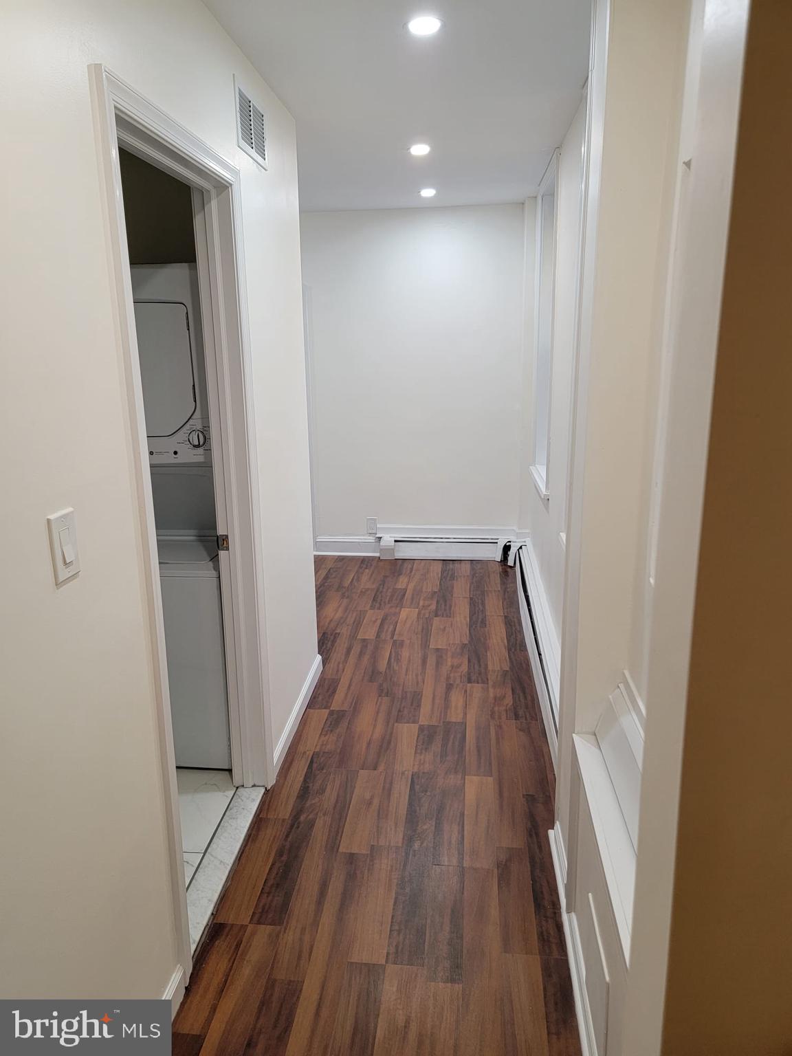 616 Tasker Street, Unit 2 Philadelphia, PA 19148 - Photo 10 of 22 a view of a hallway with wooden floor