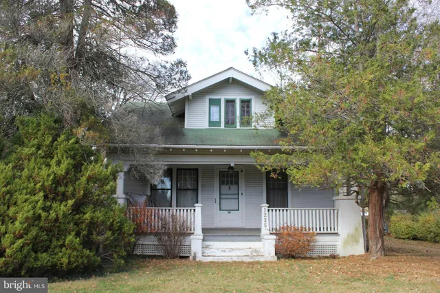 a front view of a house with garage