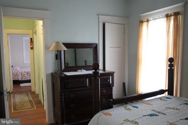 a bedroom with a bed and a dresser