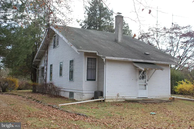 a house with trees in the background