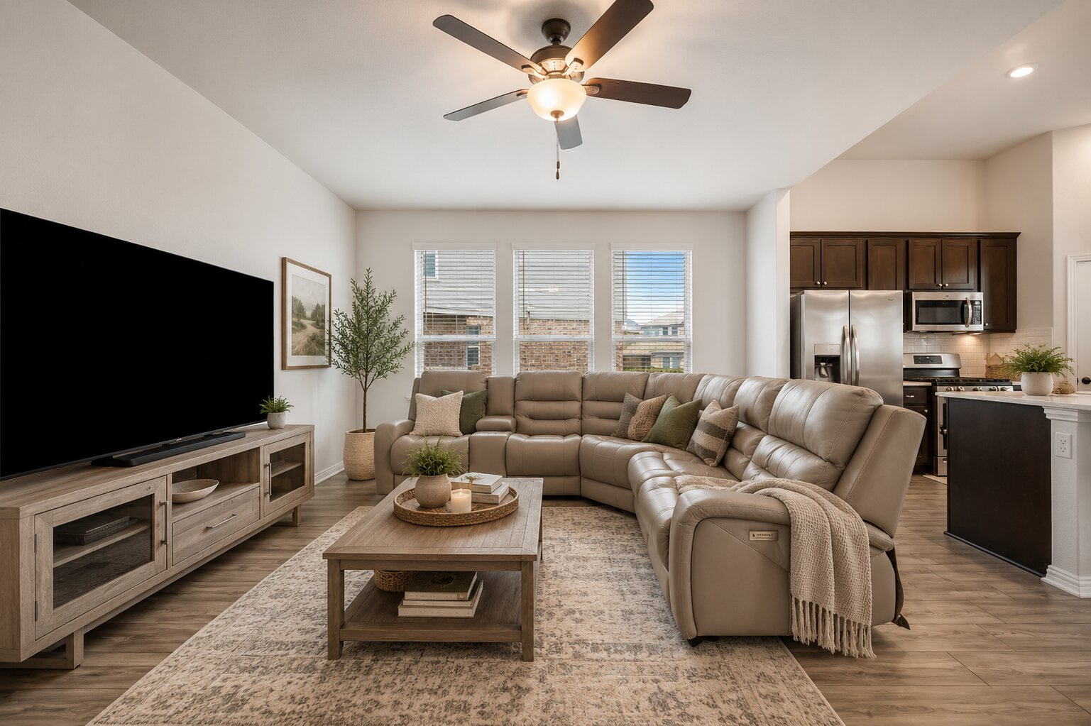 265 Fawn Riv Run Kyle, TX 78640 - Photo 38 of 39 An open floor plan connects the comfortable living space to a modern adjacent kitchen.