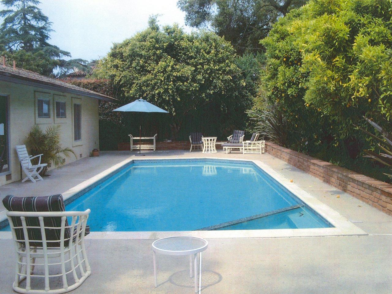 205 Middle Road Montecito, CA 93108 - Photo 6 of 7 a view of a patio with couches table and chairs under an umbrella