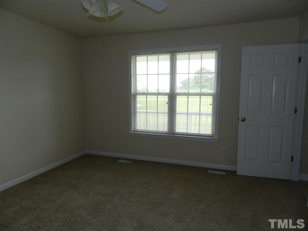99 Trail Ridge Drive Benson, NC 27504 - Photo 5 of 10 an empty room with a window