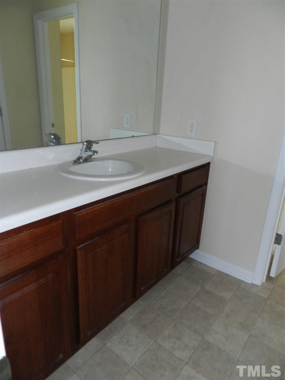 99 Trail Ridge Drive Benson, NC 27504 - Photo 6 of 10 a bathroom with a sink and a mirror