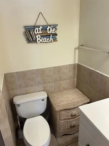 a bathroom with a toilet and a sink