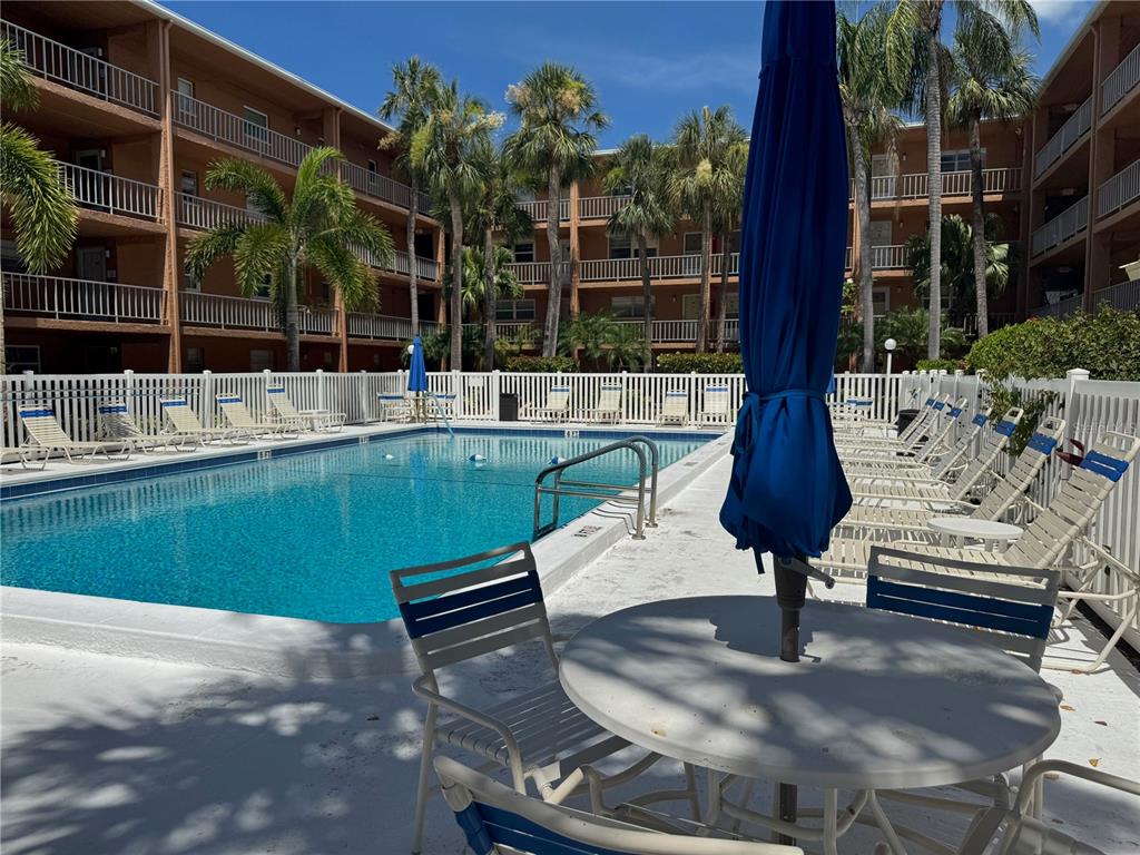 12760 Indian Rocks Road, Unit 1048 Largo, FL 33774 - Photo 19 of 24 a view of a backyard with a patio