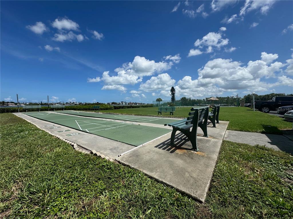 12760 Indian Rocks Road, Unit 1048 Largo, FL 33774 - Photo 21 of 24 a view of a lake with a yard