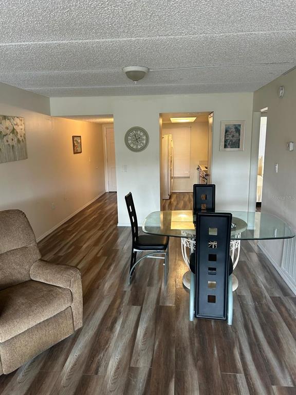 12760 Indian Rocks Road, Unit 1048 Largo, FL 33774 - Photo 5 of 24 a living room with furniture and a table