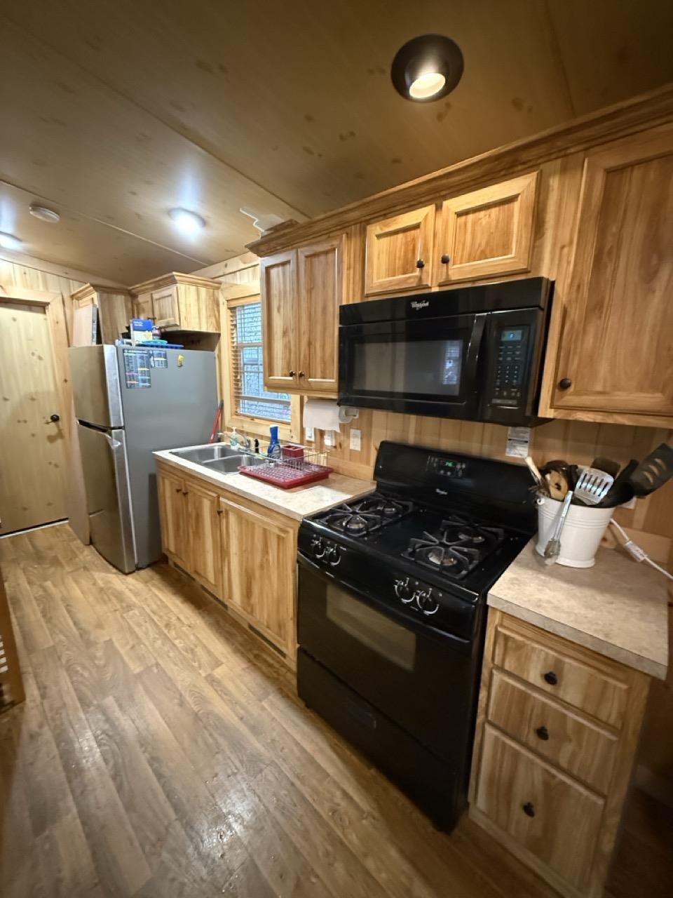 669 Highway 9 Cape May, NJ 08204 - Photo 8 of 10 a kitchen with stainless steel appliances kitchen island granite countertop a stove a sink and a microwave