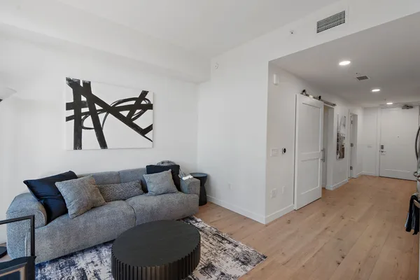 a living room with furniture and a rug