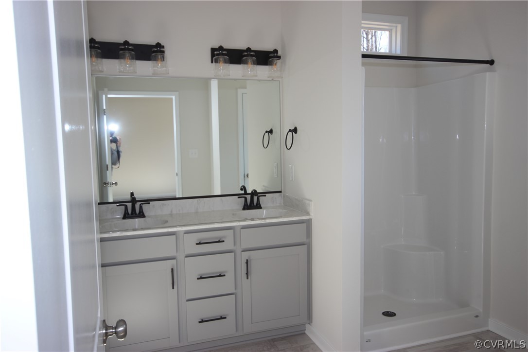 165 New S Ridge Road Bumpass, VA 23024 - Photo 12 of 26 a bathroom with a sink and a mirror