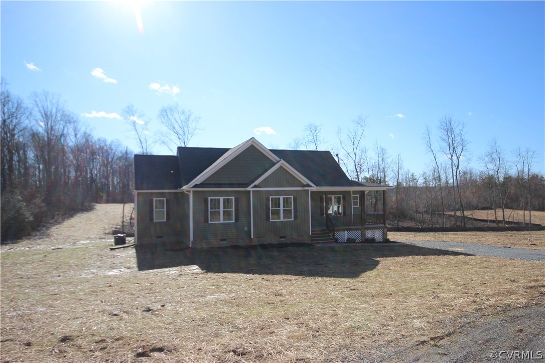 165 New S Ridge Road Bumpass, VA 23024 - Photo 2 of 26 a front view of a house with a yard and garage