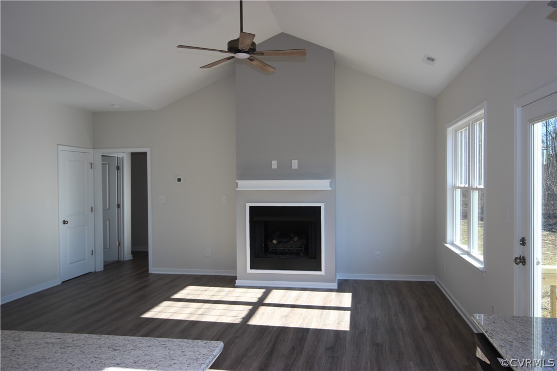165 New S Ridge Road Bumpass, VA 23024 - Photo 5 of 26 a living room with fireplace and wooden floor